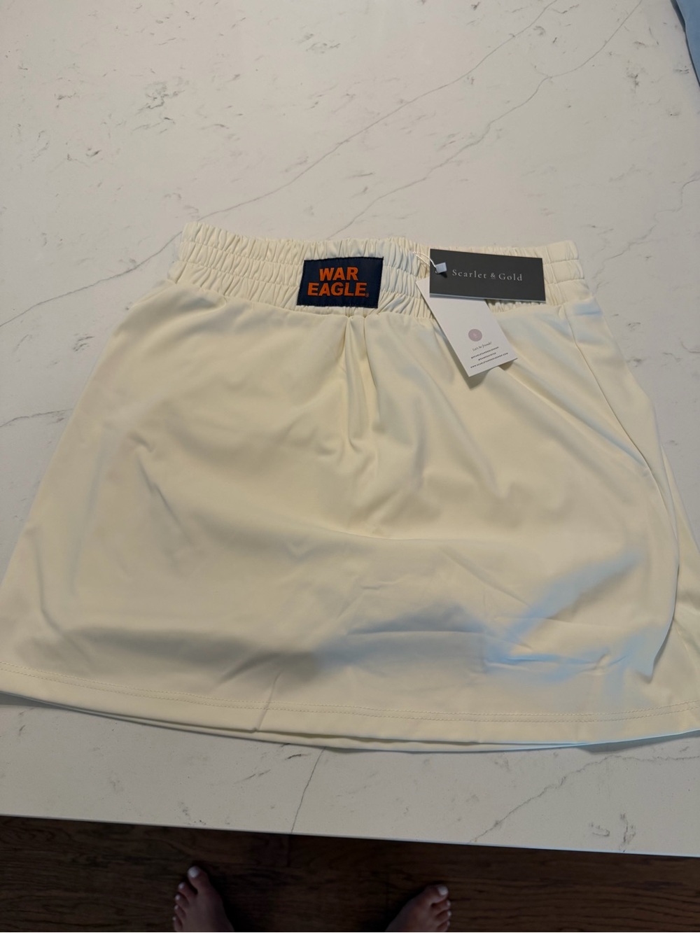Cream Athletic Mini Skirt with War Eagle Tag